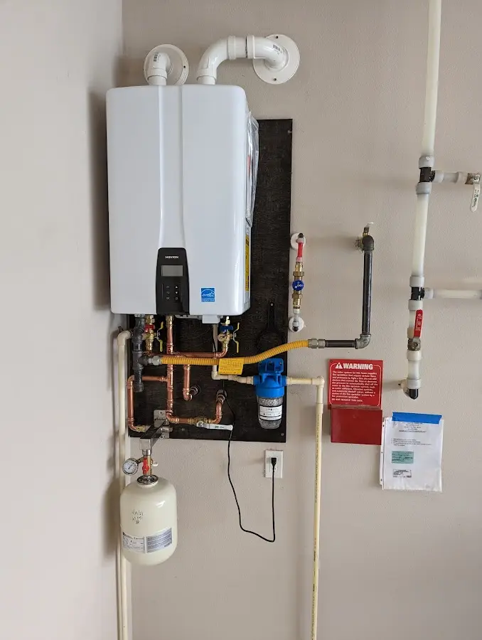 Professional plumber installing copper piping in a North Hartsville home